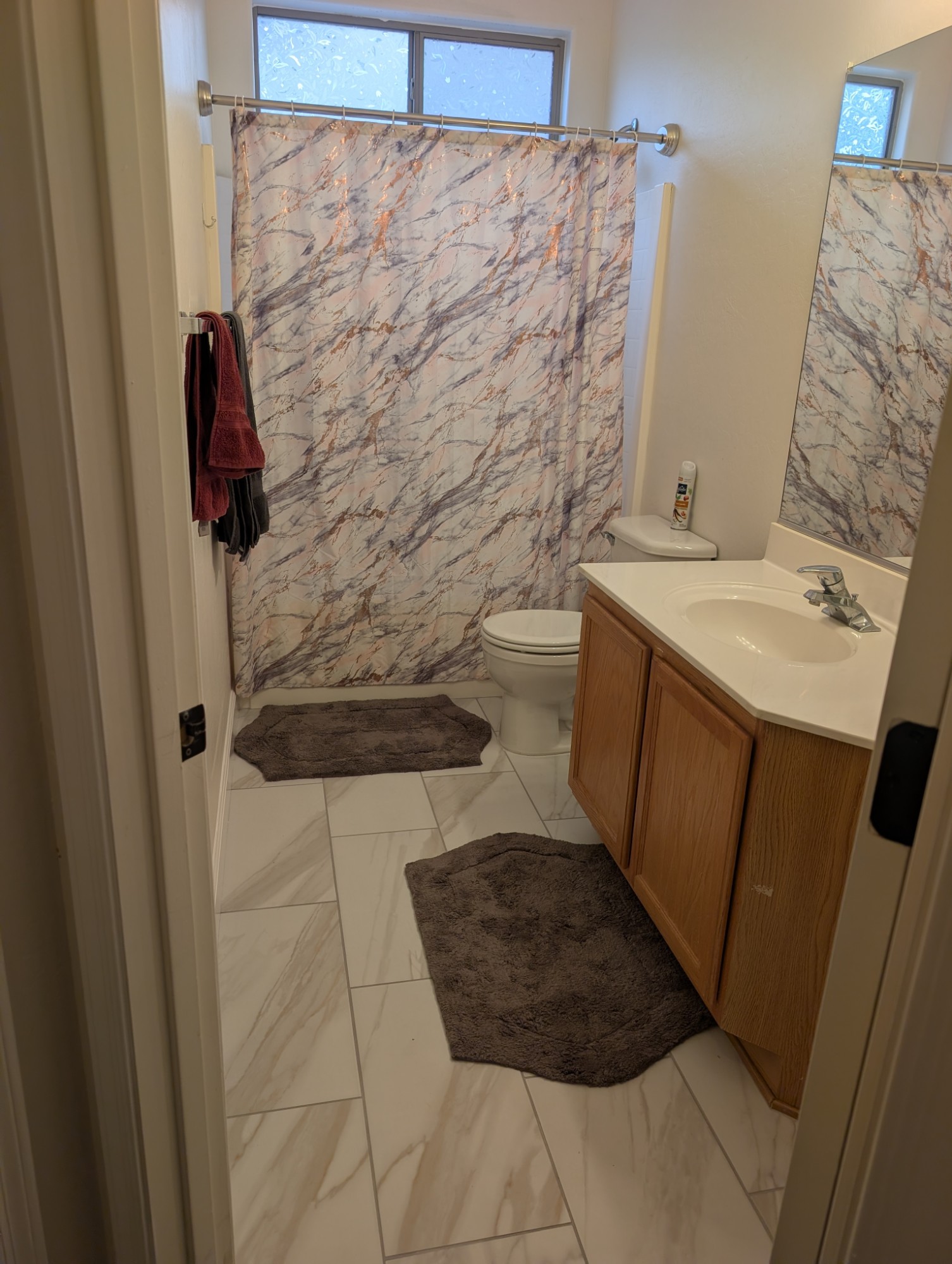 Hall bathroom with new marble-look tile floor