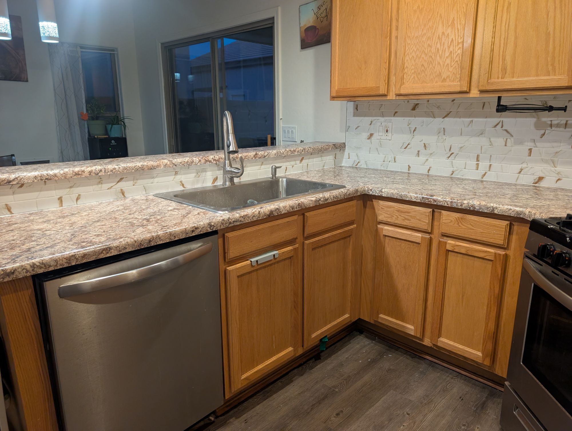 Kitchen sink, dishwasher, and breakfast bar