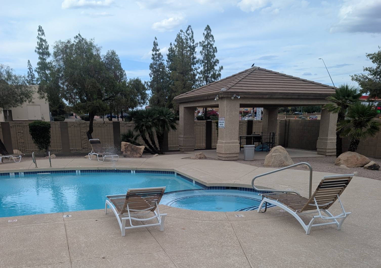 Community spa (hot tub) next to the pool